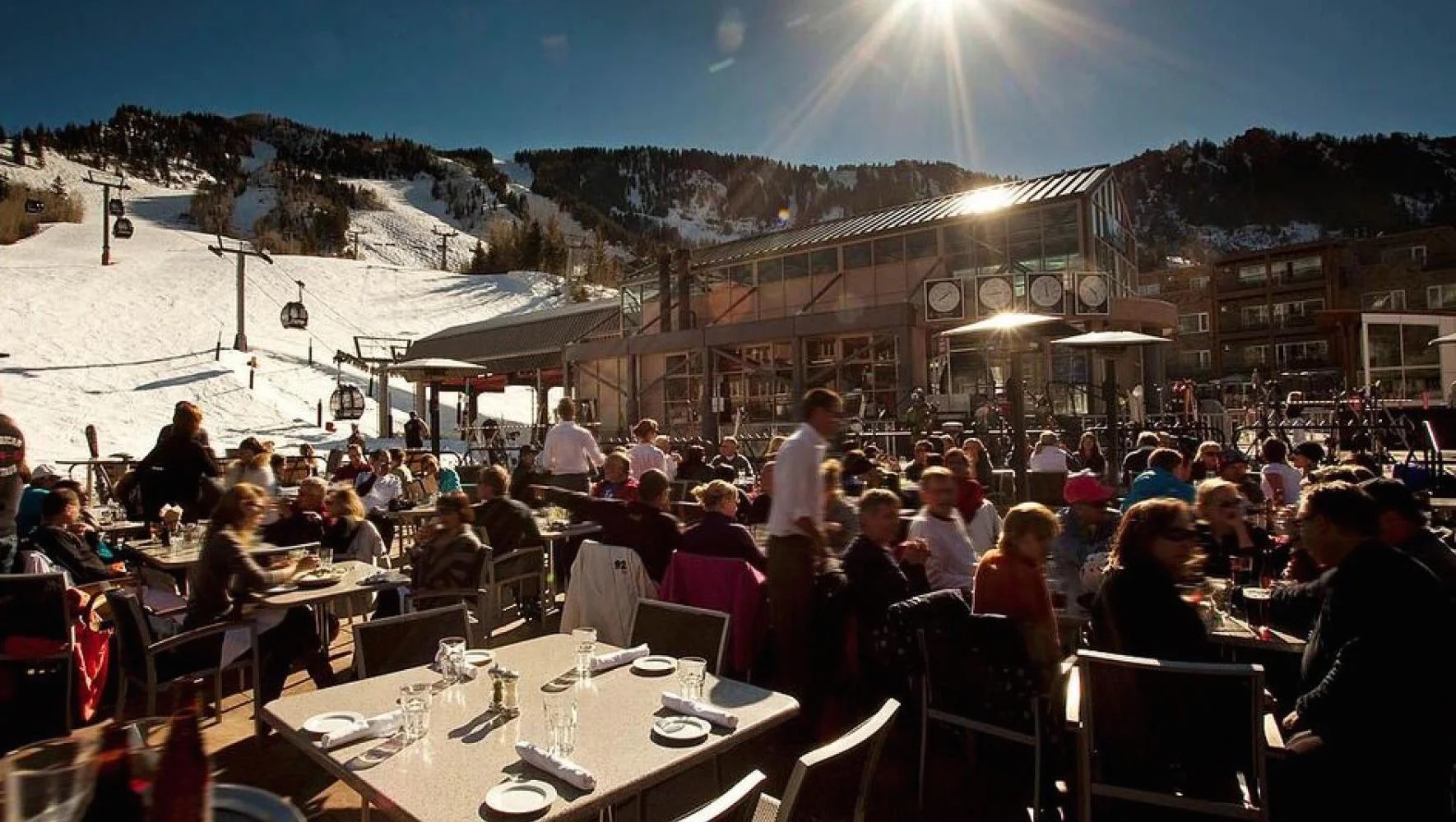 Sam's Smokehouse deck at the top of Sam's Knob — the classic mid-mountain après scene at Snowmass