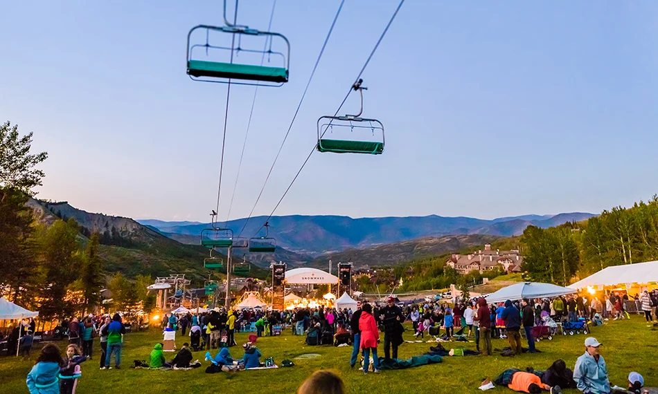 Snowmass Village in summer with green mountain trails